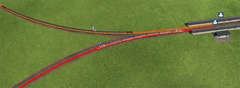 Red and orange railway route overlays converging near a station